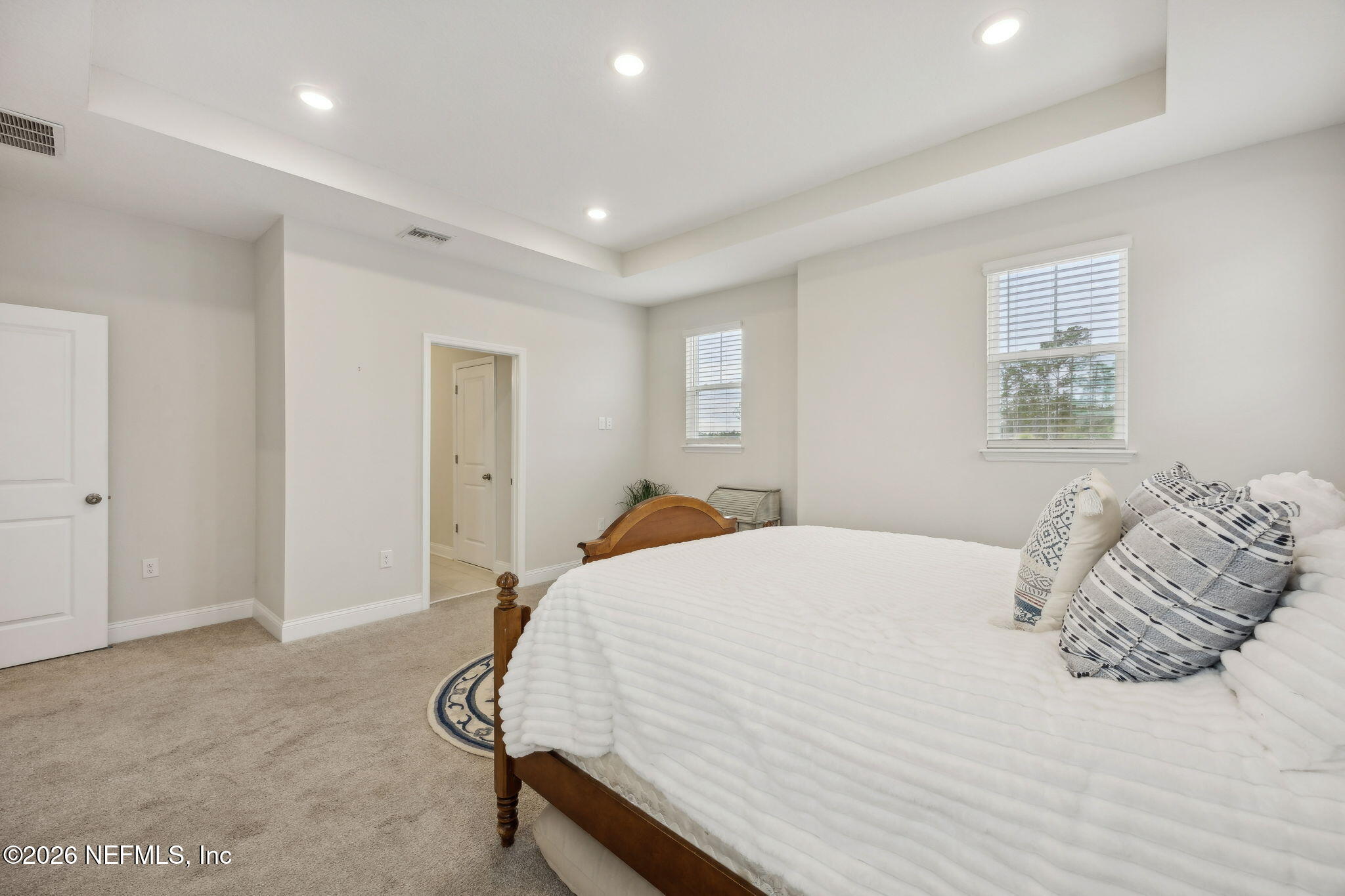 141 Redbud Lane Yulee, FL 32097 - Photo 29 of 77 a bedroom with a bed and a dresser