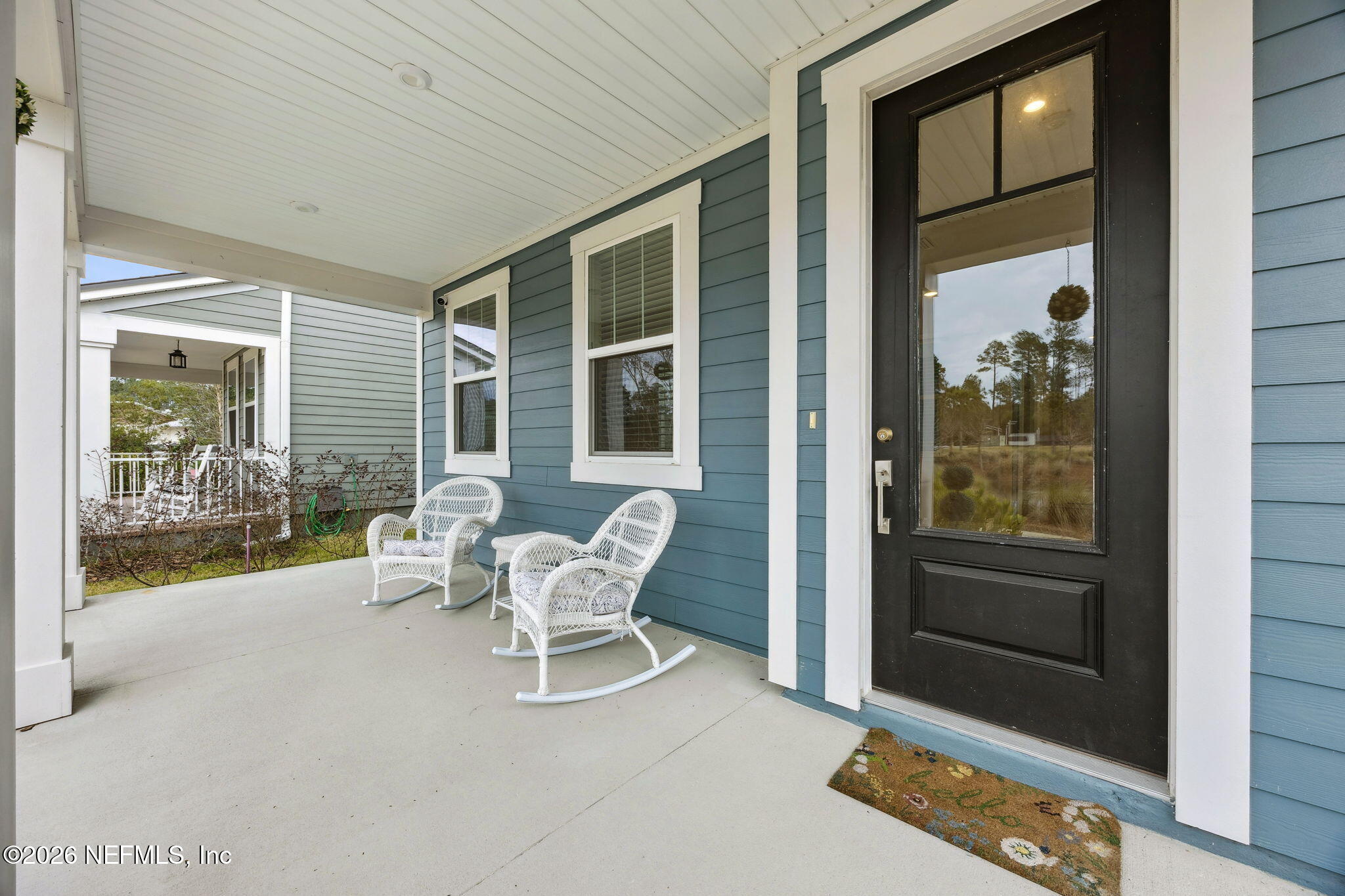 141 Redbud Lane Yulee, FL 32097 - Photo 3 of 77 a balcony with couple of chairs and a couch