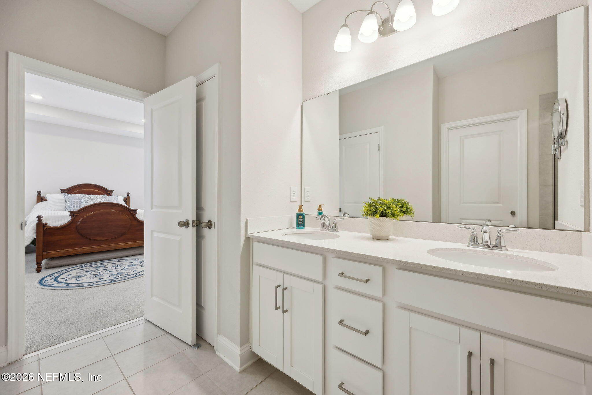 141 Redbud Lane Yulee, FL 32097 - Photo 34 of 77 a bathroom with a sink and a mirror