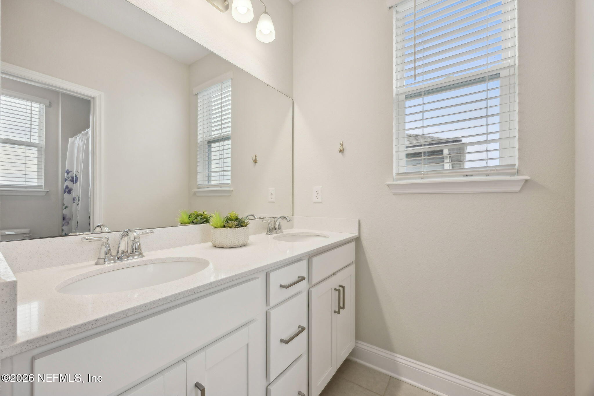 141 Redbud Lane Yulee, FL 32097 - Photo 37 of 77 a bathroom with a sink and a mirror