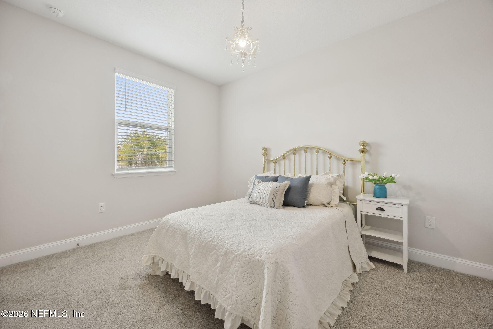 141 Redbud Lane Yulee, FL 32097 - Photo 40 of 77 a bedroom with a bed and a window