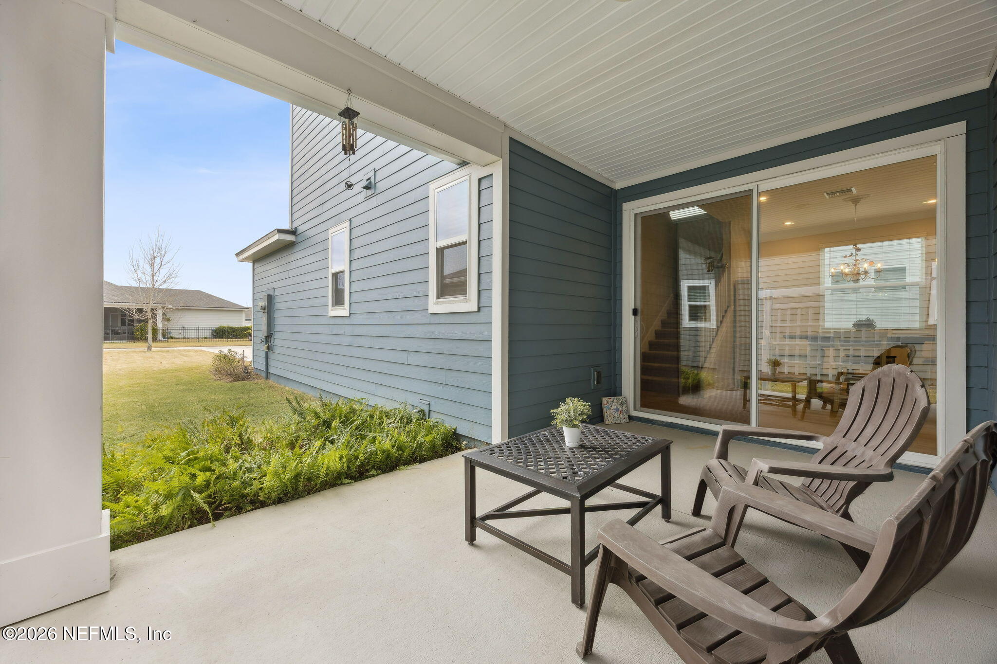 141 Redbud Lane Yulee, FL 32097 - Photo 45 of 77 a balcony with couple of chairs and a couch