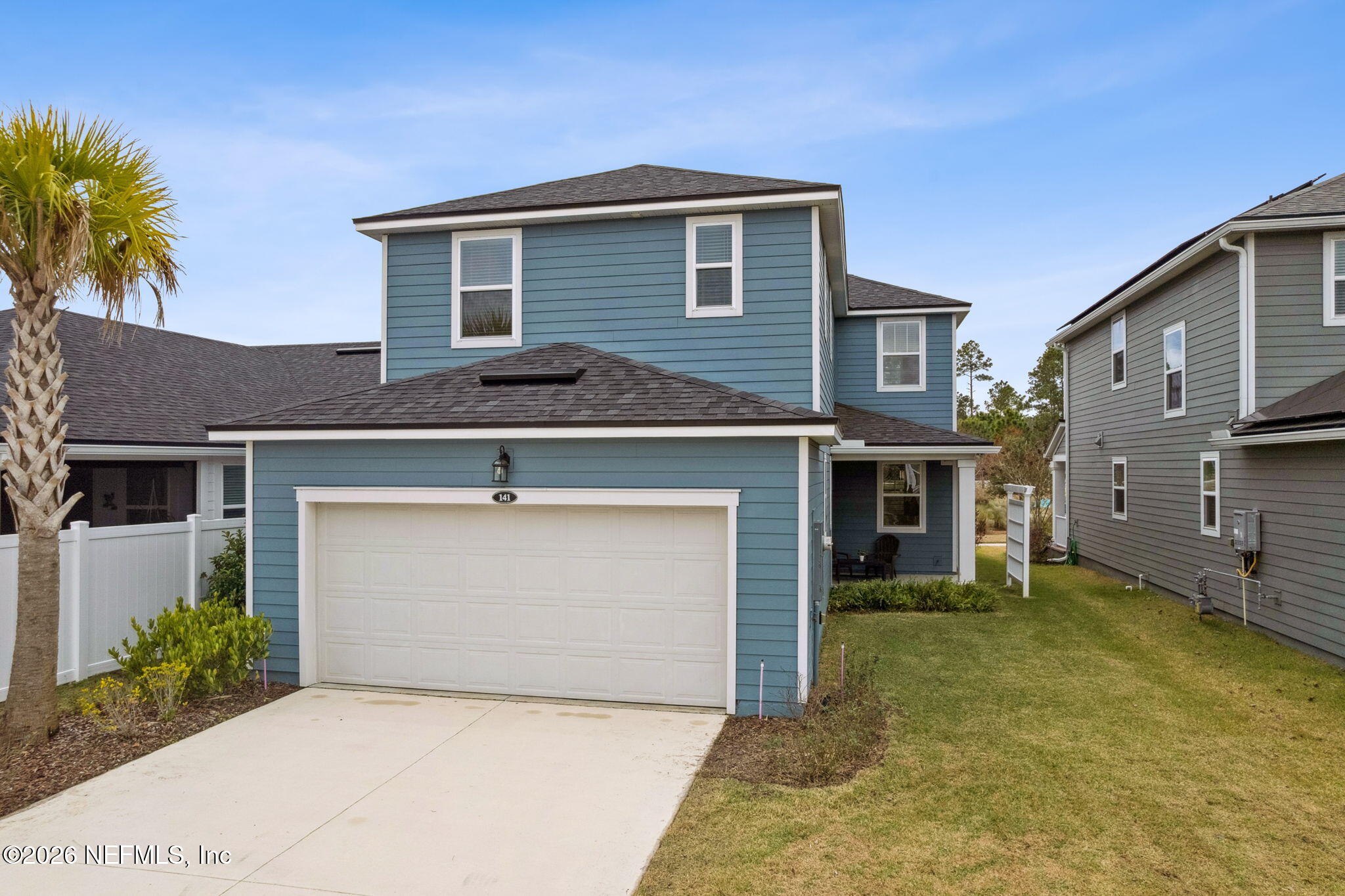 141 Redbud Lane Yulee, FL 32097 - Photo 47 of 77 a front view of a house with a garage