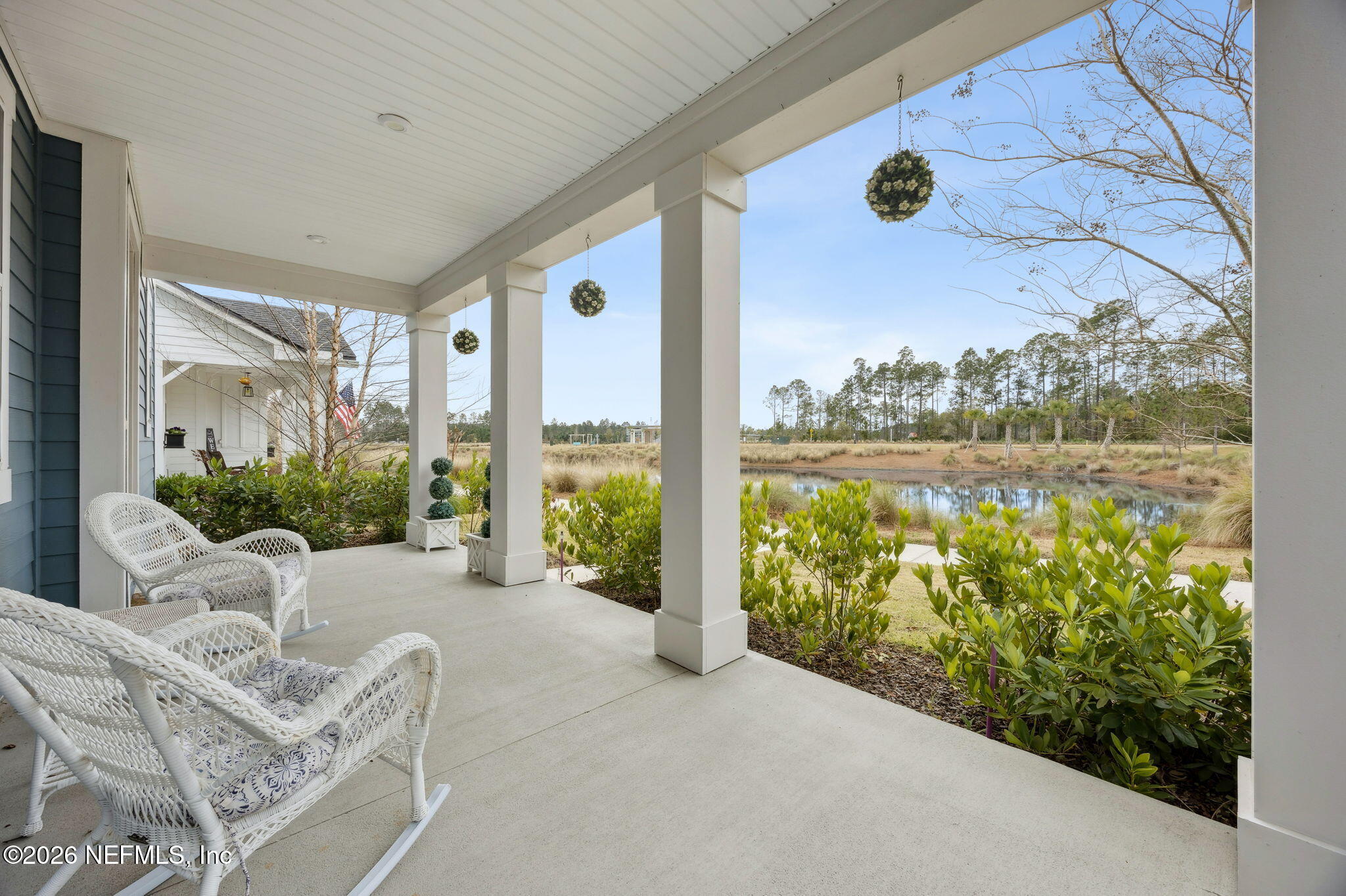 141 Redbud Lane Yulee, FL 32097 - Photo 5 of 77 a balcony with furniture and garden view