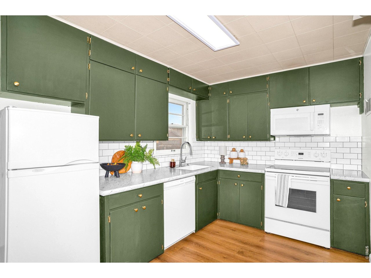 1915 7th Street Greeley, CO 80631 - Photo 7 of 29 Kitchen with lots of cabinetry