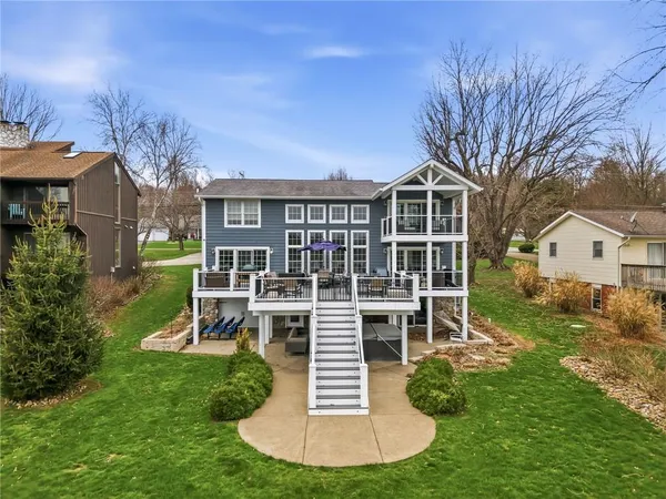 a view of a roof deck with wooden floor and fence