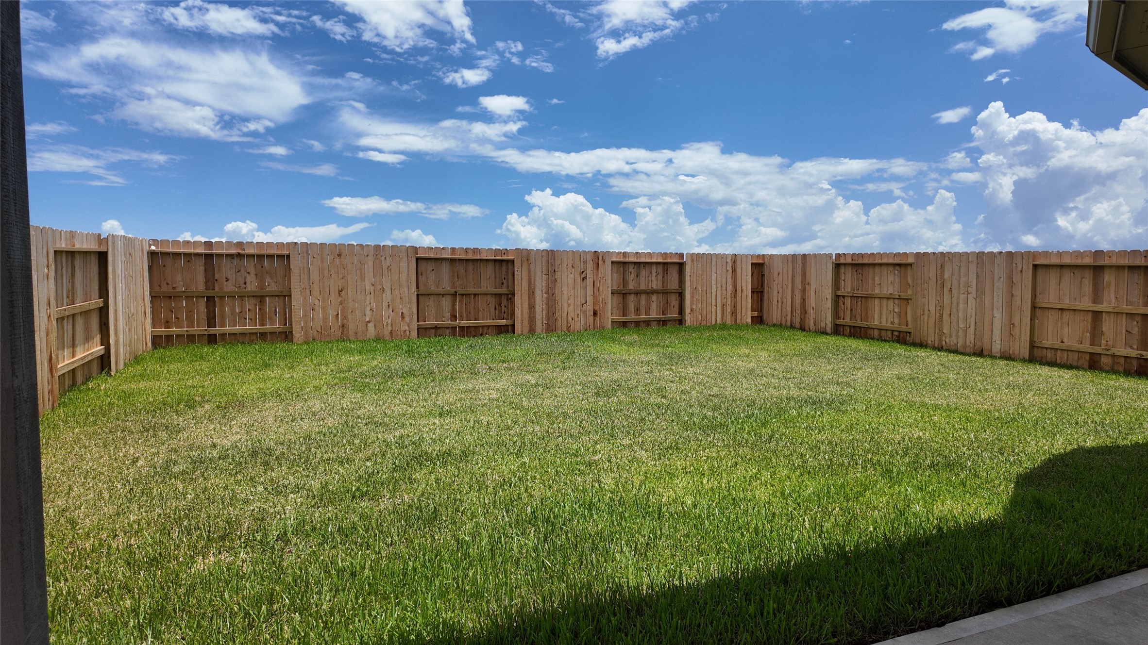 15645 Wandering Maple Way Conroe, TX 77302 - Photo 9 of 14 a view of a yard with wooden fence