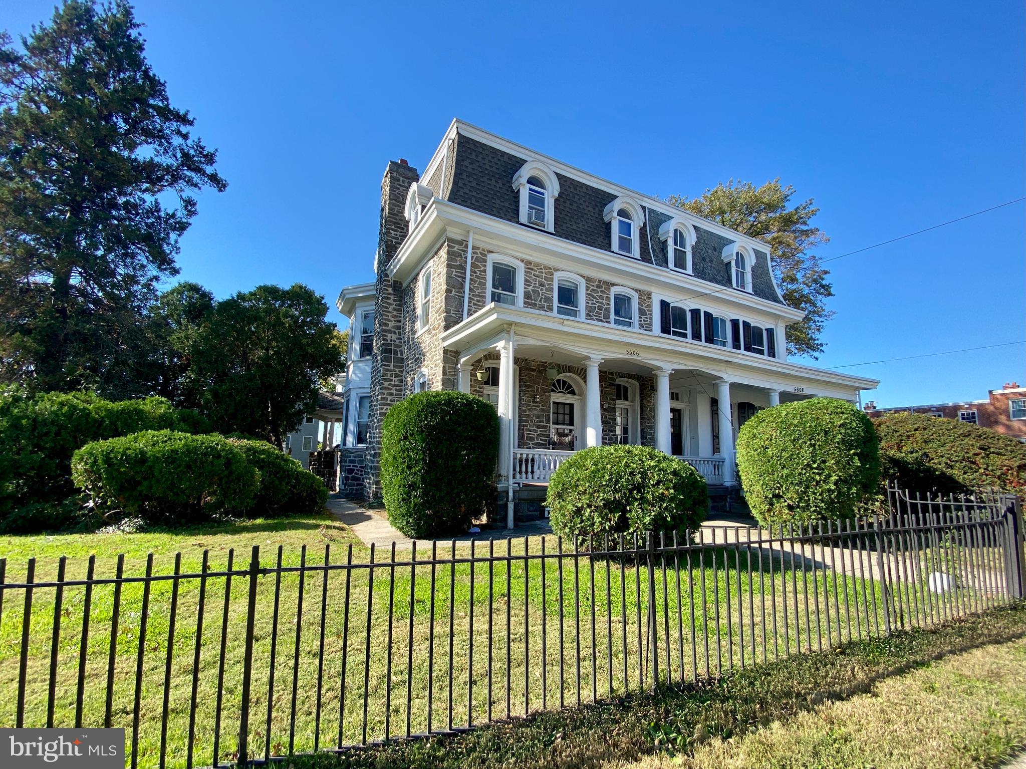 5606 Ridge Avenue, Unit 3F Philadelphia, PA 19128 - Photo 10 of 10 a view of a house with a garden and plants