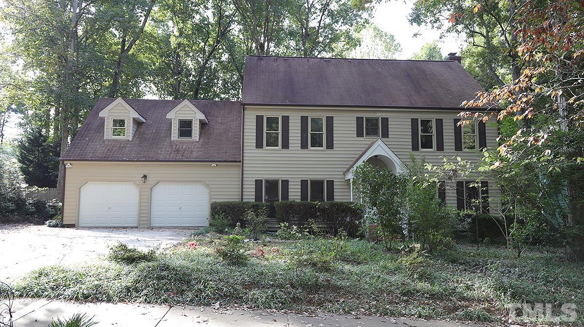 8700 Mourning Dove Road Raleigh, NC 27615 - Photo 1 of 30 a front view of a house with a garden