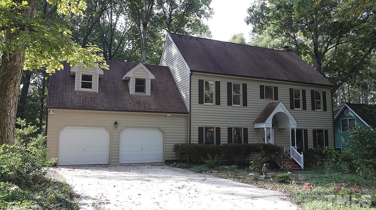 8700 Mourning Dove Road Raleigh, NC 27615 - Photo 2 of 30 a front view of a house with a yard