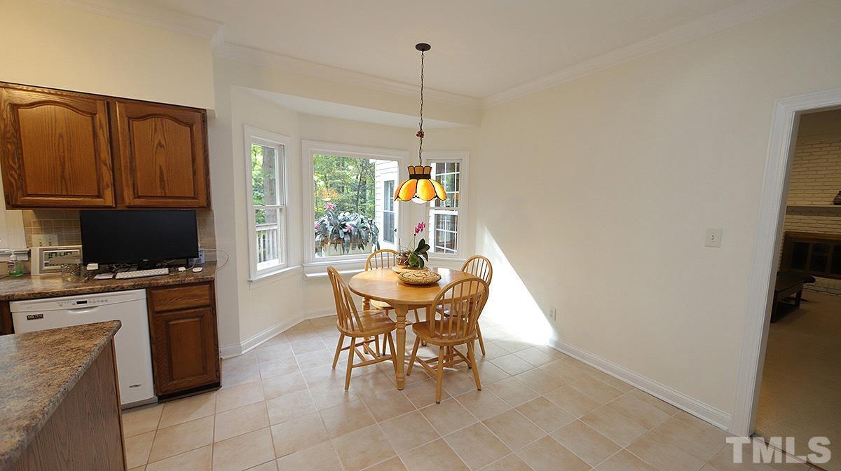 8700 Mourning Dove Road Raleigh, NC 27615 - Photo 12 of 30 a view of a dining room with furniture window and outside view