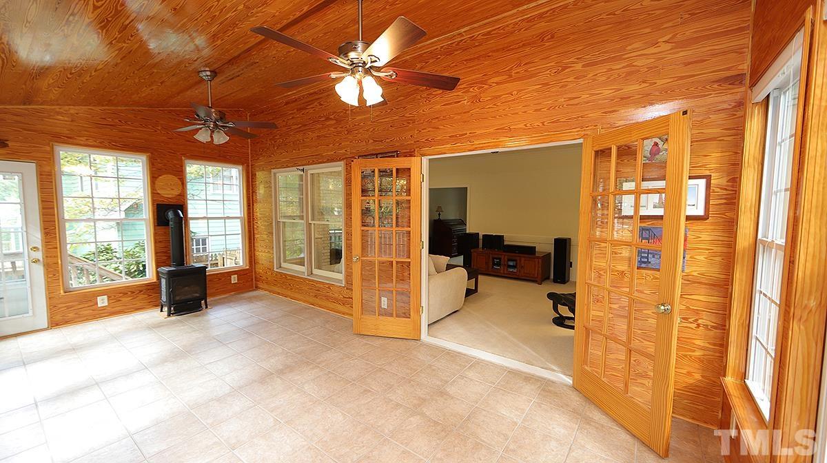 8700 Mourning Dove Road Raleigh, NC 27615 - Photo 18 of 30 a view of a spacious bedroom with furniture and large windows