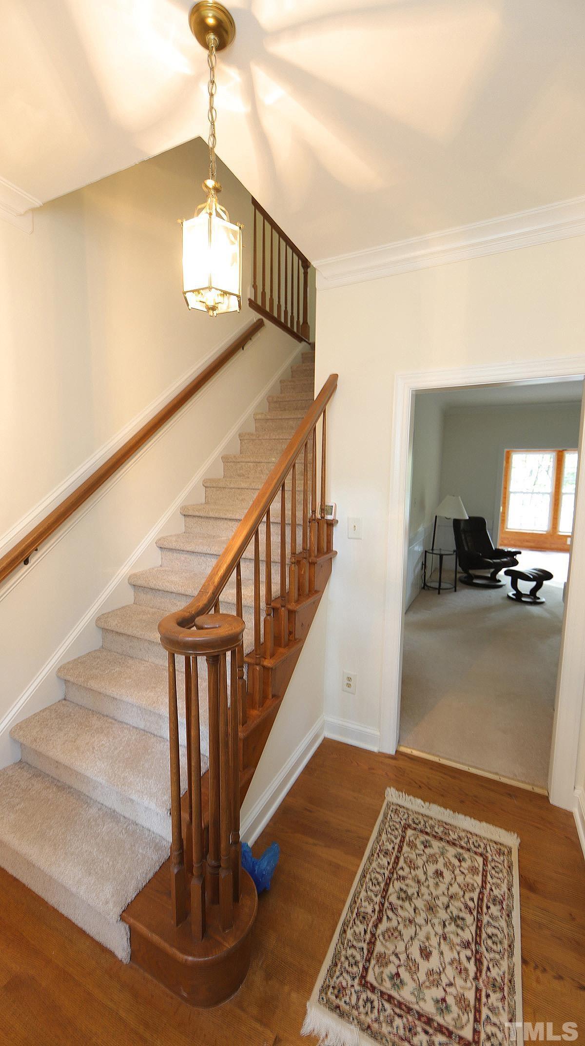 8700 Mourning Dove Road Raleigh, NC 27615 - Photo 3 of 30 a view of entryway and hall with wooden floor