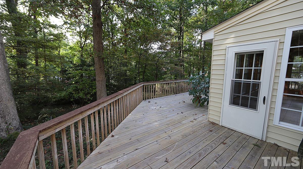 8700 Mourning Dove Road Raleigh, NC 27615 - Photo 27 of 30 a view of balcony with wooden floor and fence