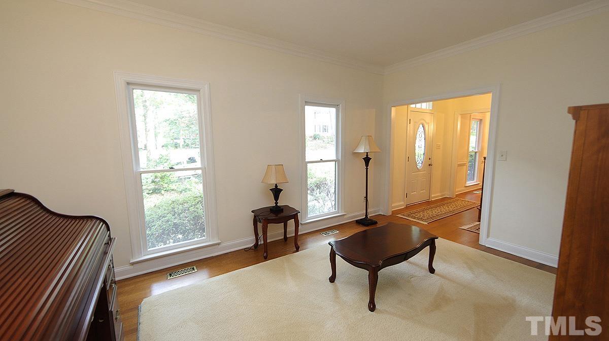 8700 Mourning Dove Road Raleigh, NC 27615 - Photo 6 of 30 a living room with furniture and a window