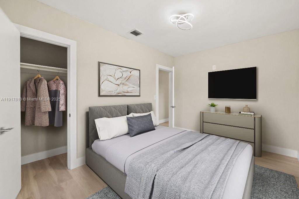 14760 Fillmore Street Miami, FL 33176 - Photo 11 of 23 a bedroom with a bed and a flat screen tv