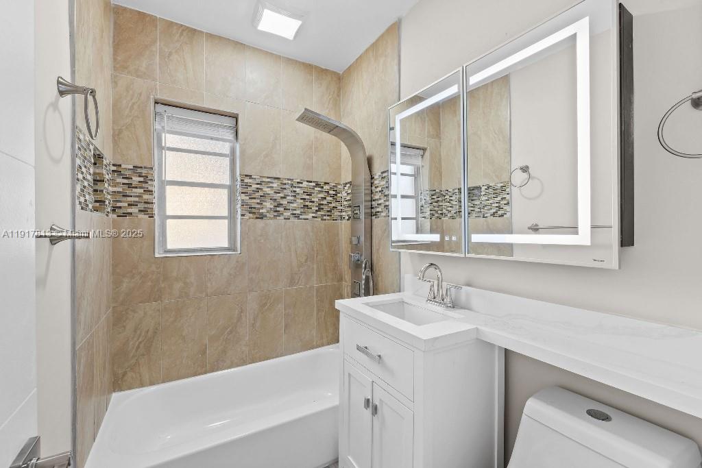 14760 Fillmore Street Miami, FL 33176 - Photo 15 of 23 a bathroom with a sink a mirror and a bathtub