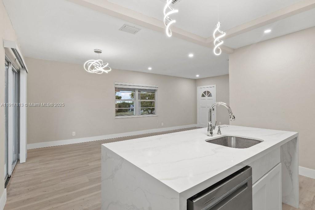 14760 Fillmore Street Miami, FL 33176 - Photo 16 of 23 a kitchen with a sink a counter space and a refrigerator