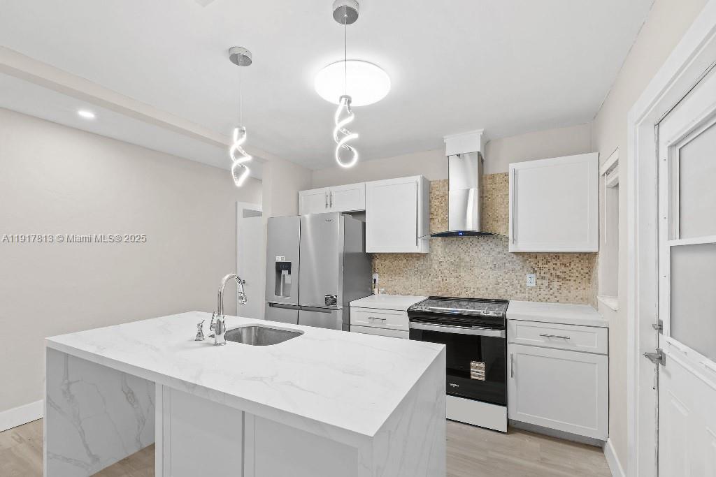 14760 Fillmore Street Miami, FL 33176 - Photo 18 of 23 a kitchen with a sink stove and refrigerator