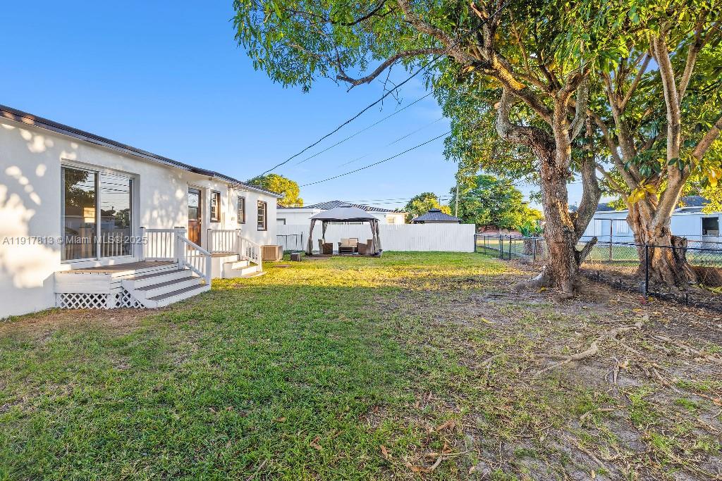 14760 Fillmore Street Miami, FL 33176 - Photo 19 of 23 a view of a house with a yard