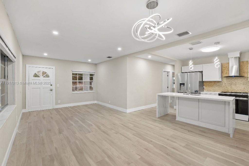 14760 Fillmore Street Miami, FL 33176 - Photo 2 of 23 a view of a kitchen with a sink and dishwasher a refrigerator with wooden floor