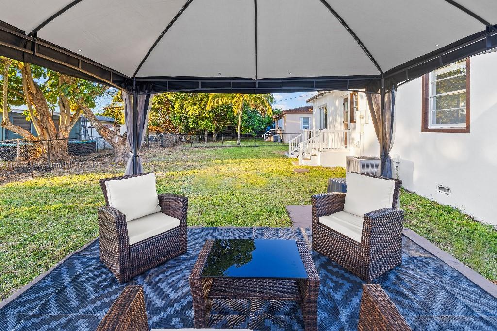 14760 Fillmore Street Miami, FL 33176 - Photo 22 of 23 a outdoor living space with furniture and a flat screen tv