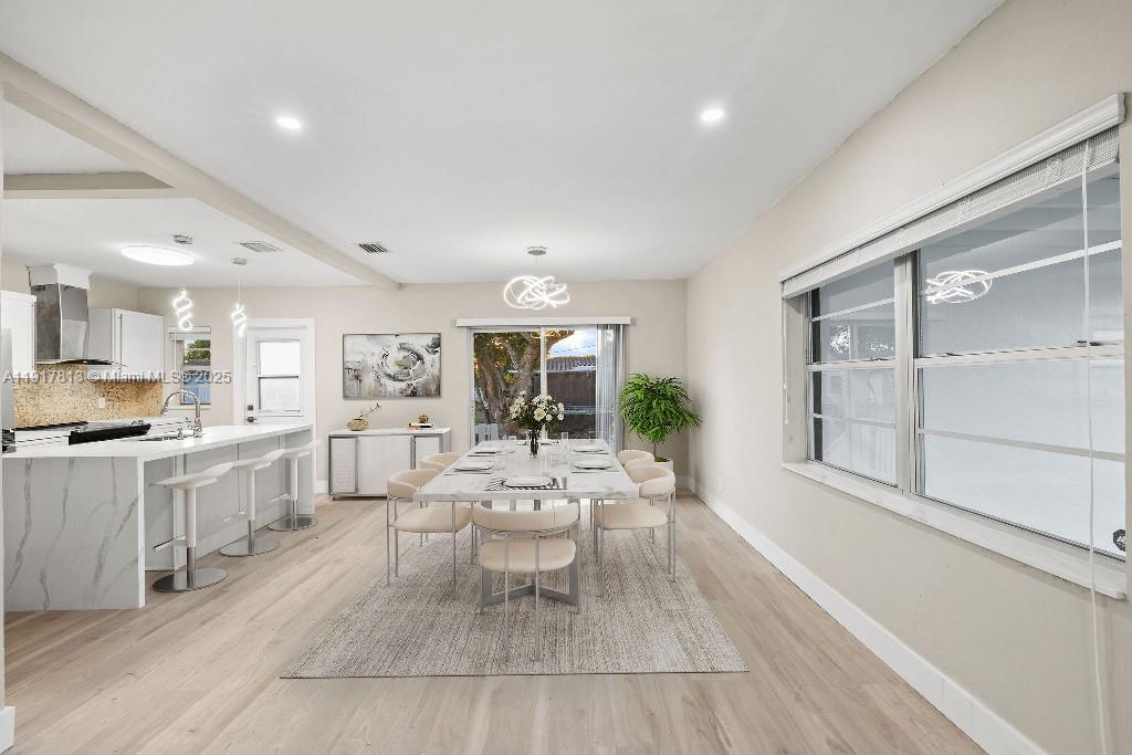 14760 Fillmore Street Miami, FL 33176 - Photo 3 of 23 a living room with furniture a wooden floor and a large window