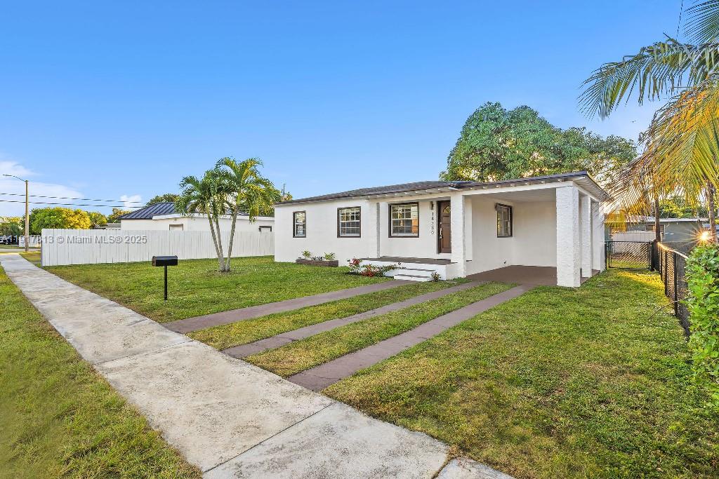 14760 Fillmore Street Miami, FL 33176 - Photo 6 of 23 a view of a house with backyard and a tree