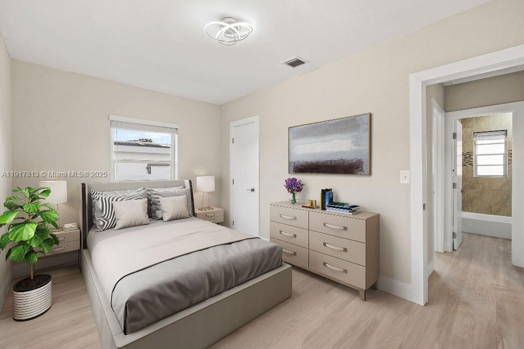 14760 Fillmore Street Miami, FL 33176 - Photo 9 of 23 a bedroom with a large bed and a flat tv screen on dresser