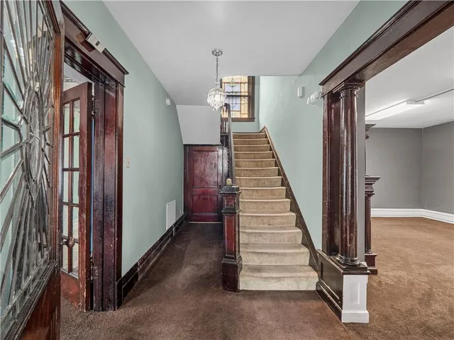 a view of a hallway with staircase