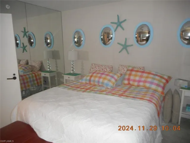 a bedroom with a bed and a chair