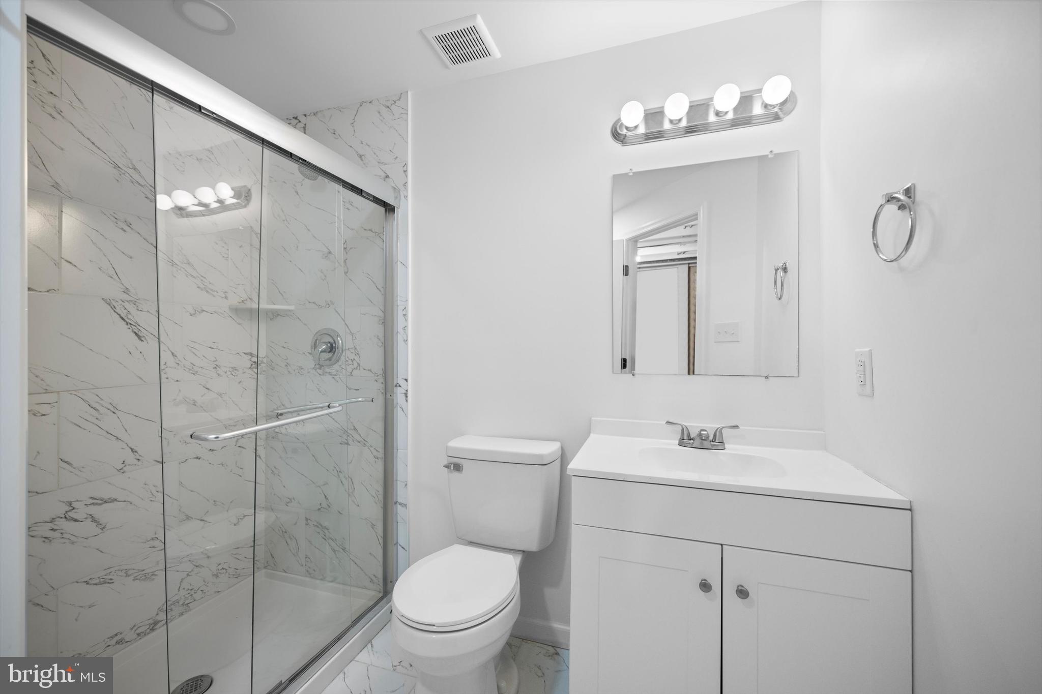 14640 Endsley Turn Woodbridge, VA 22193 - Photo 20 of 27 a bathroom with a toilet sink vanity granite and shower