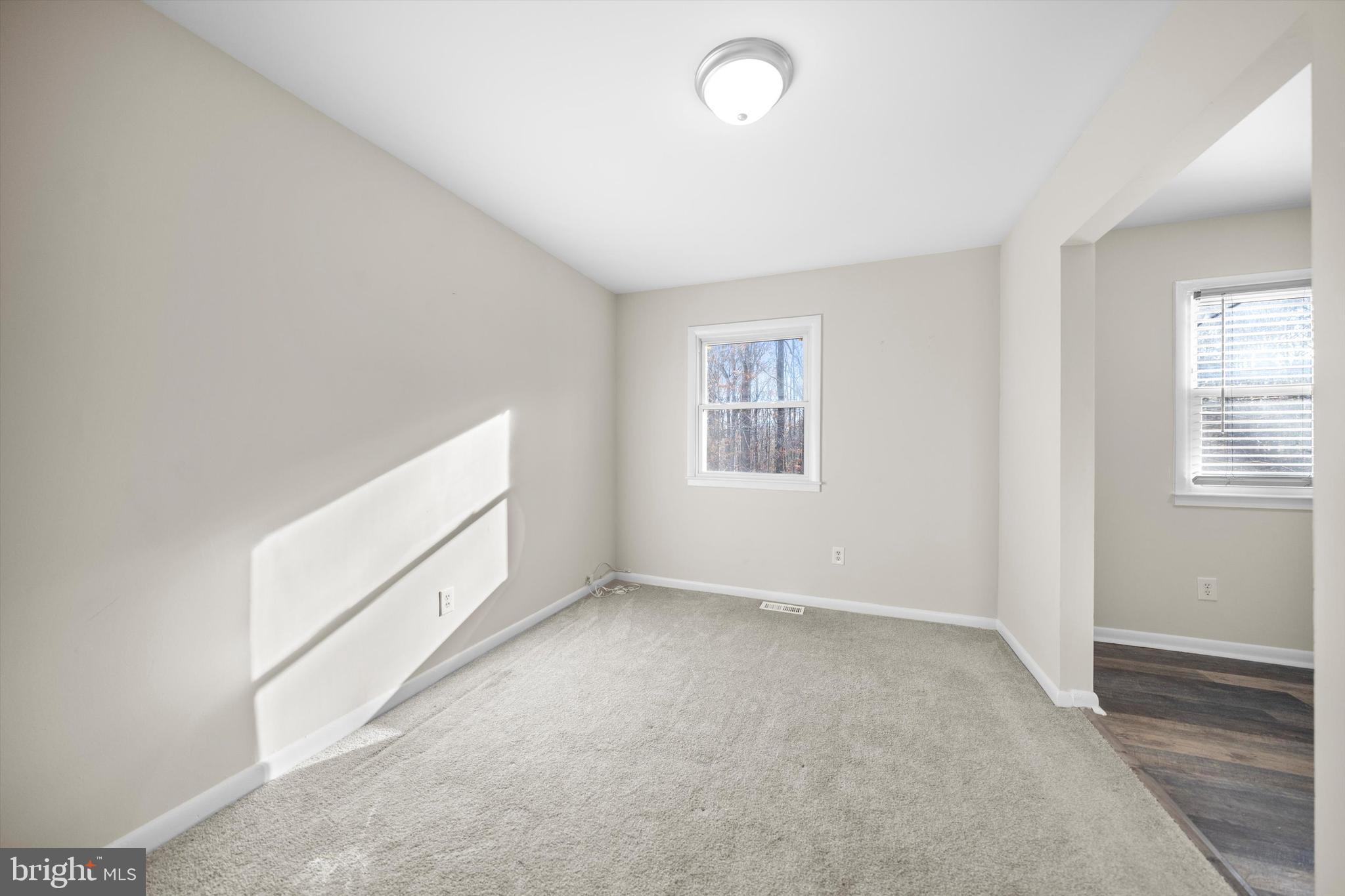 14640 Endsley Turn Woodbridge, VA 22193 - Photo 6 of 27 an empty room with windows
