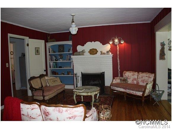 105 Hunting Country Road Tryon, NC 28782 - Photo 3 of 16 a living room with furniture and a fireplace