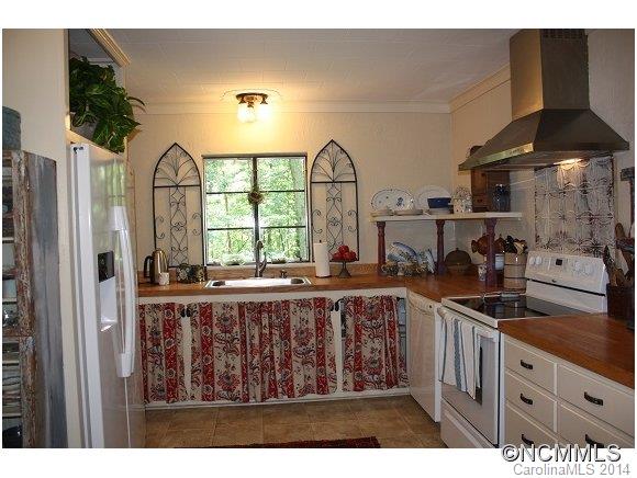 105 Hunting Country Road Tryon, NC 28782 - Photo 5 of 16 a view of a kitchen with a window