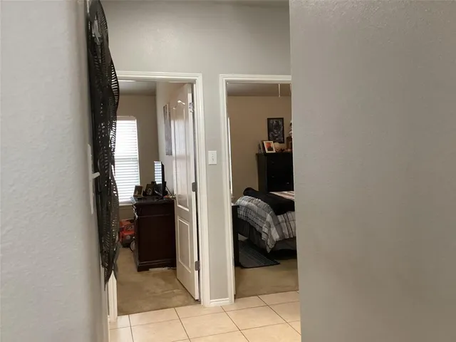 a bathroom with a shower and mirror