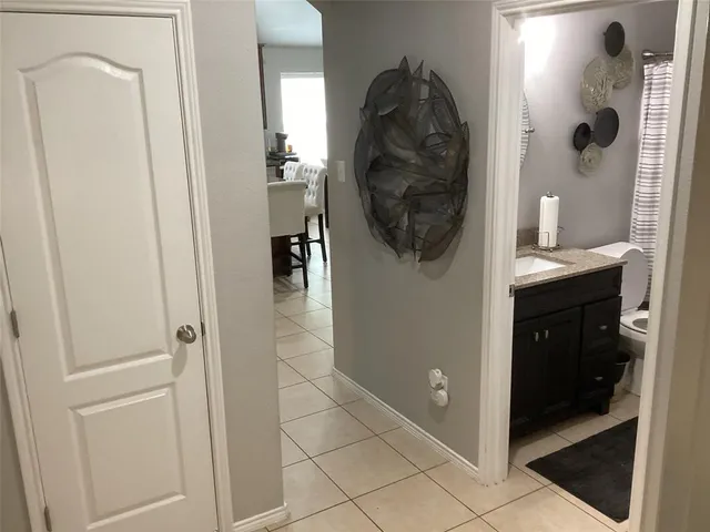 a bathroom with a sink and a shower