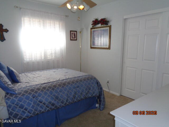 43043 Flag Street Lancaster, CA 93536 - Photo 16 of 29 a bedroom with a bed and a window