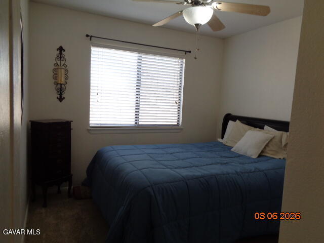 43043 Flag Street Lancaster, CA 93536 - Photo 17 of 29 a bed sitting in a bedroom next to a window