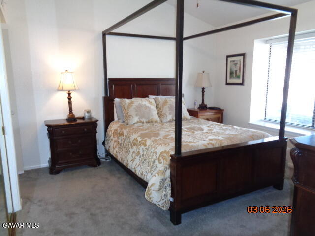 43043 Flag Street Lancaster, CA 93536 - Photo 20 of 29 a bedroom with a bed and a night stand