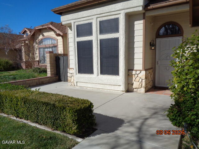 43043 Flag Street Lancaster, CA 93536 - Photo 4 of 29 a front view of a house with a yard