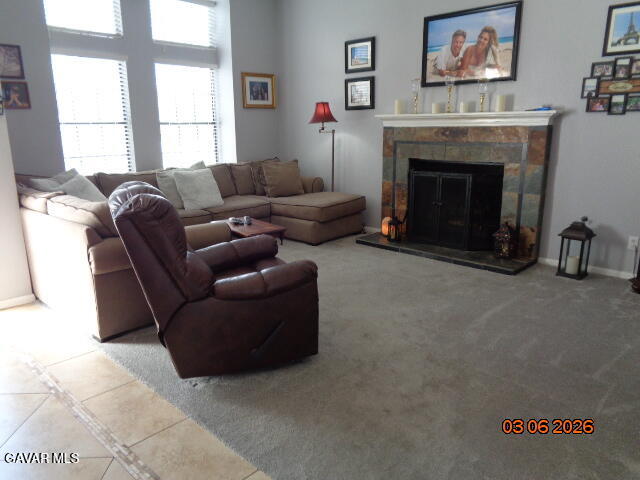 43043 Flag Street Lancaster, CA 93536 - Photo 7 of 29 a living room with furniture a fireplace and a large window