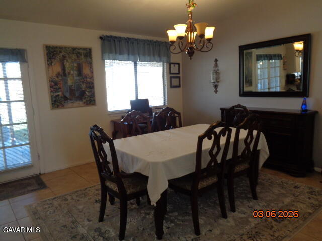 43043 Flag Street Lancaster, CA 93536 - Photo 8 of 29 a view of a dining room with furniture and window