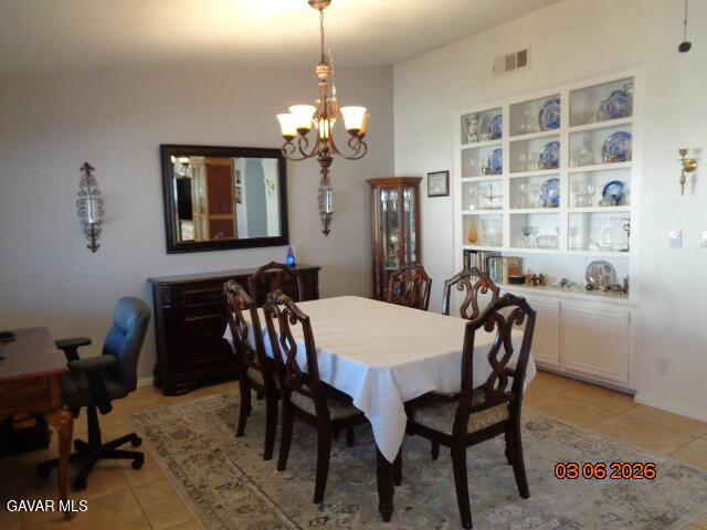43043 Flag Street Lancaster, CA 93536 - Photo 9 of 29 a view of a dining room with furniture and chandelier