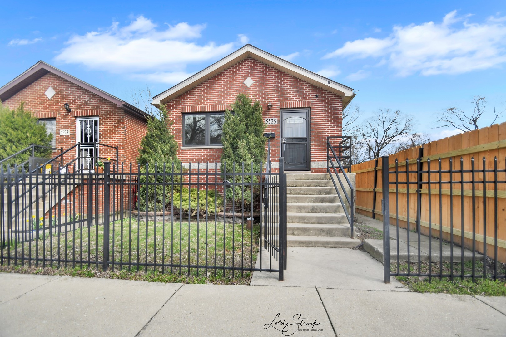 5525 South Emerald Avenue Chicago, IL 60621 - Photo 1 of 29 a front view of a house with a garden