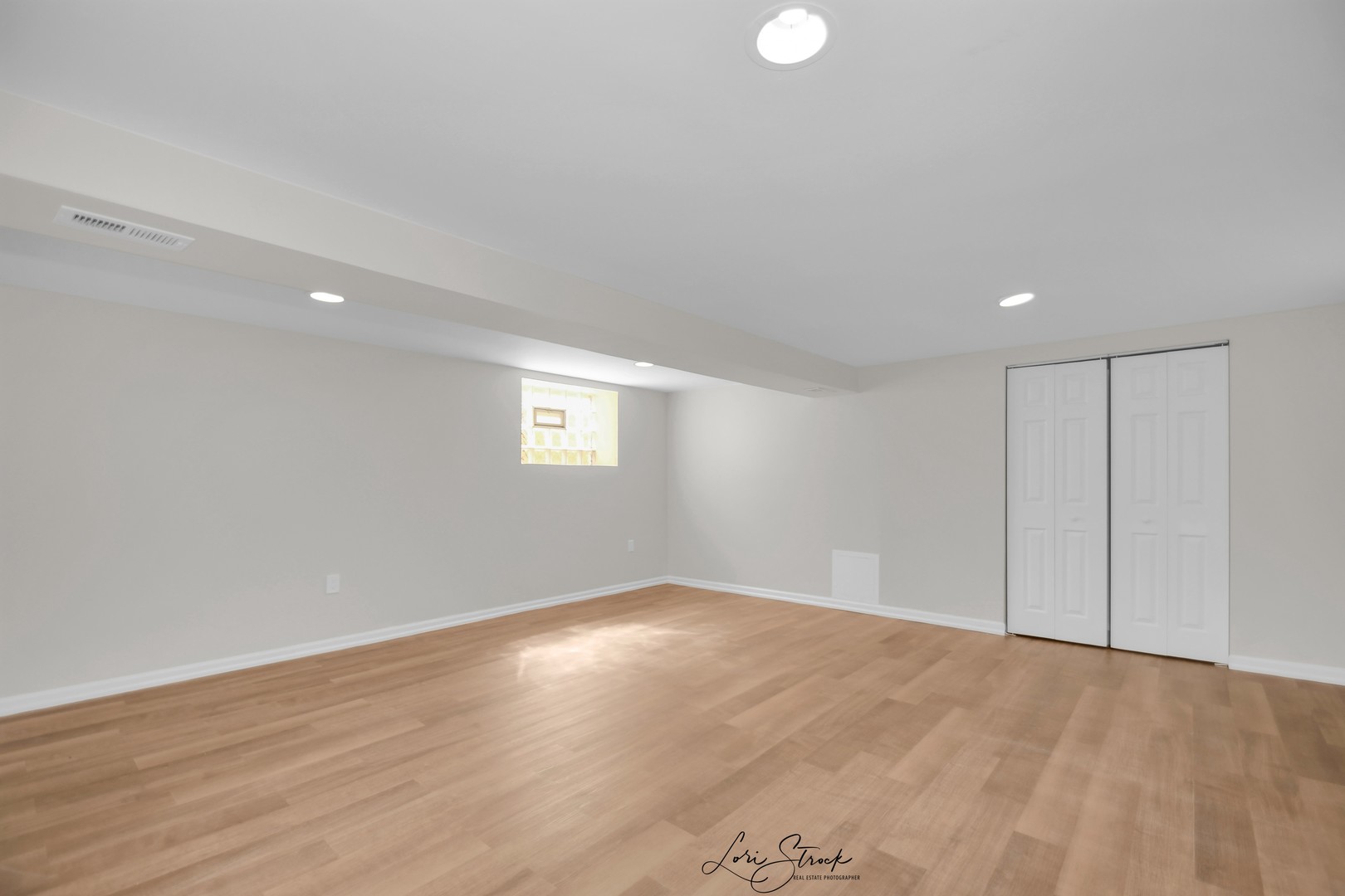 5525 South Emerald Avenue Chicago, IL 60621 - Photo 23 of 29 a view of an empty room with wooden floor and a window