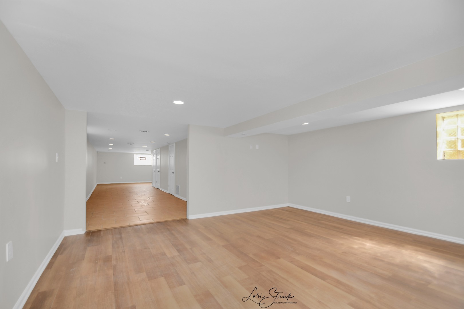5525 South Emerald Avenue Chicago, IL 60621 - Photo 24 of 29 a view of an empty room with wooden floor and a window