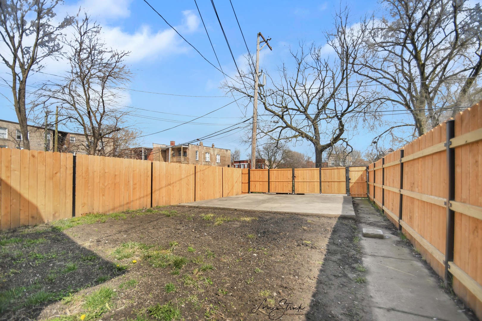 5525 South Emerald Avenue Chicago, IL 60621 - Photo 28 of 29 a view of a yard with a house