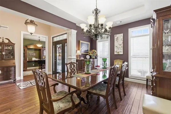 a view of a dining room with furniture window and wooden floor