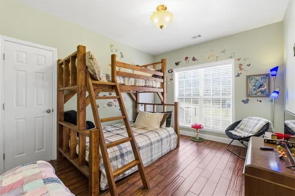a bedroom with furniture and a window